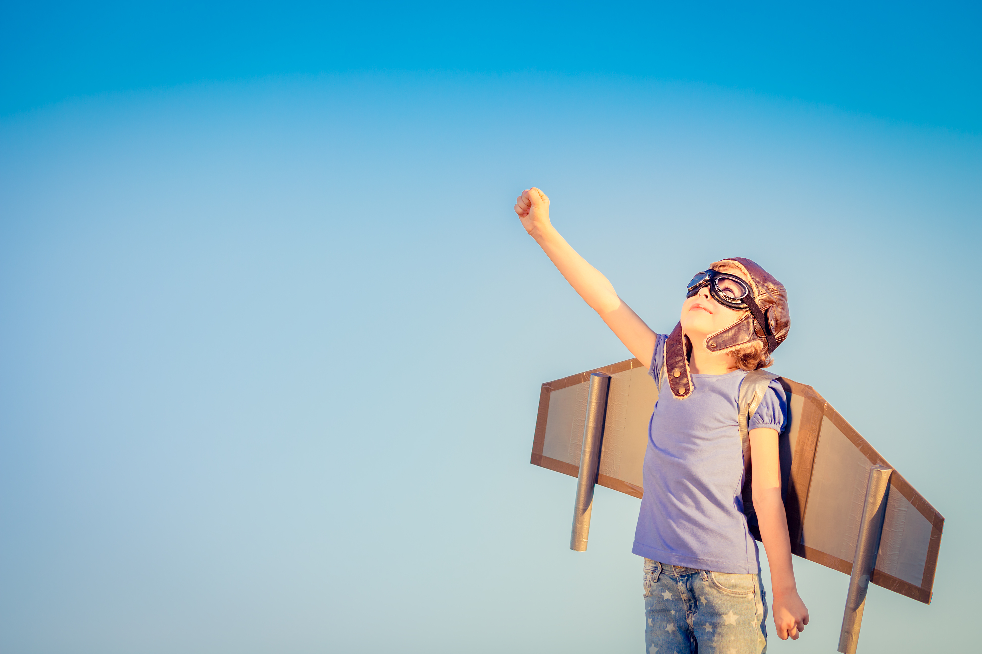 Happy-child-playing-with-toy-wings-against-summer-sky-background-Shutterstock-ID-305346116-Name-or-Project-forskning-FGT-003 (1).jpg